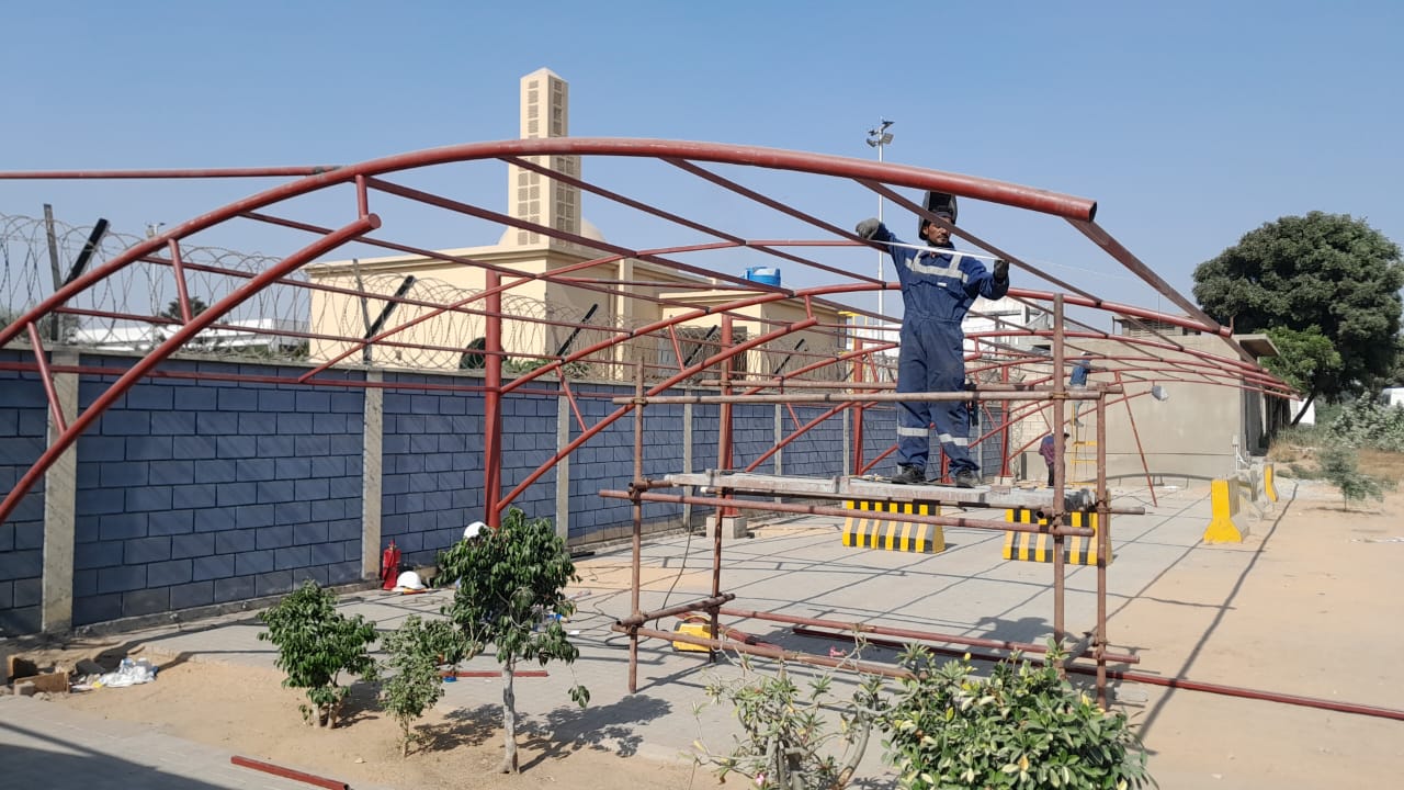 Steel frame fabrication and erection at industrial site